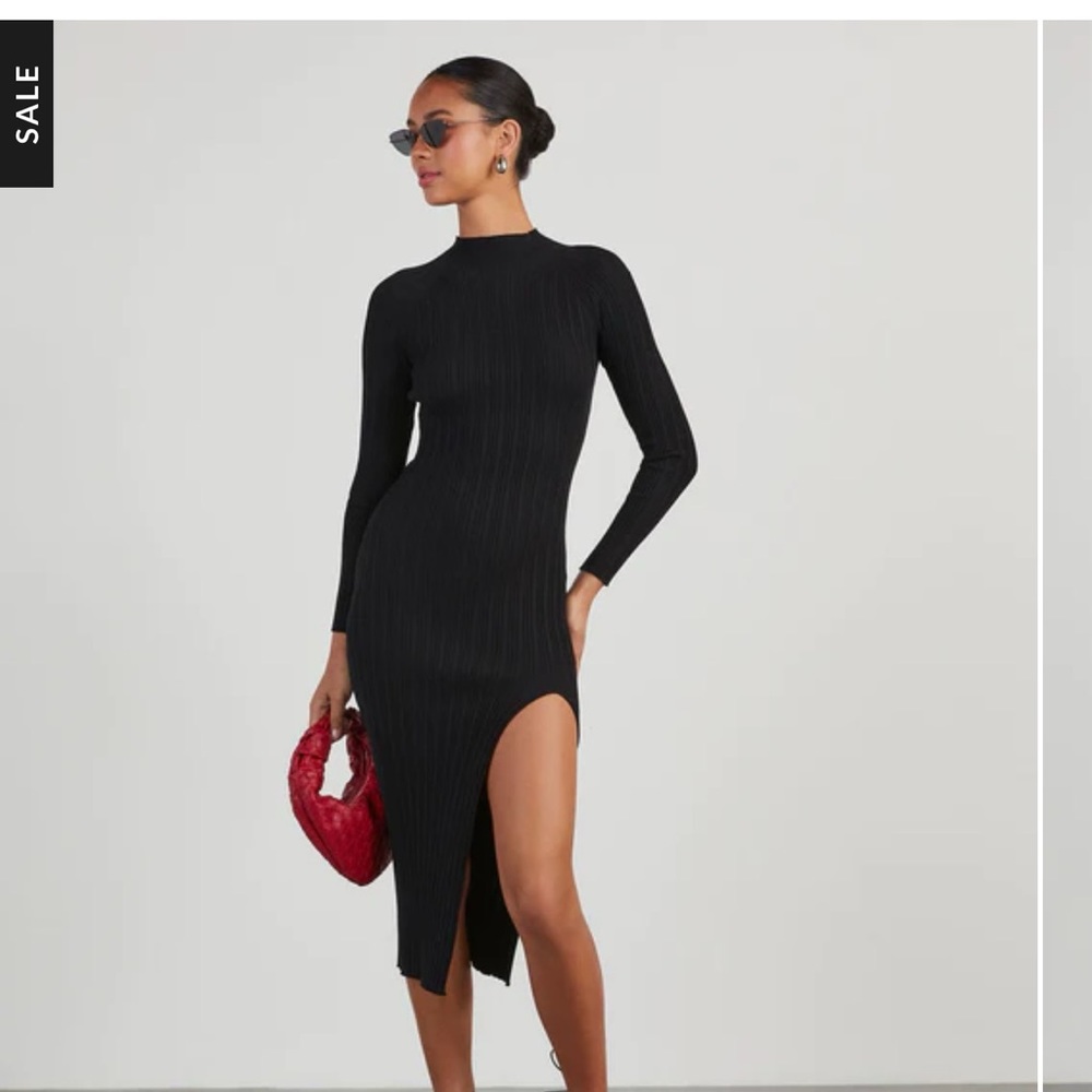 Vici black sweater dress with slit.  High neck.  New